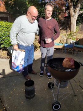 Chris and T.J. manning the smoked ham