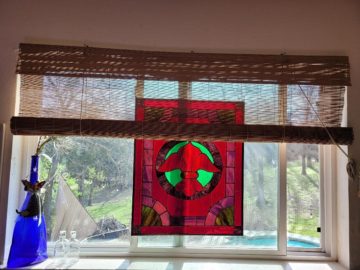 A piece of red stained glass art